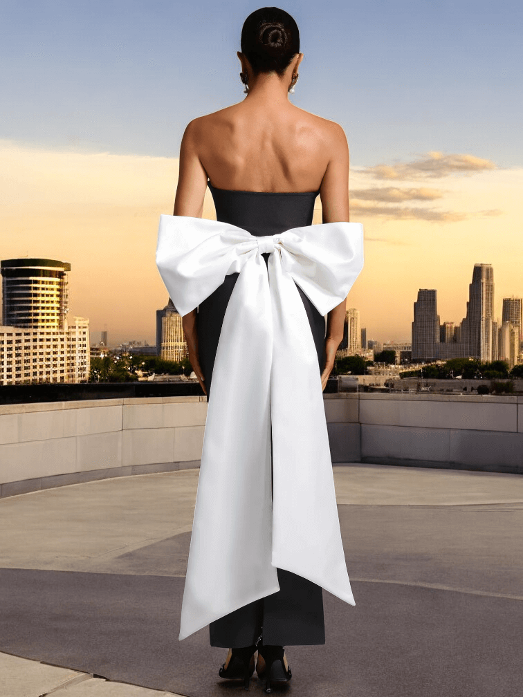 Black sleeveless bandage maxi dress with white bow and open back for evening events