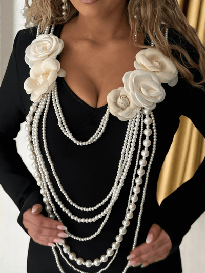 Black mini bandage dress with long sleeves, floral texture, and pearl chain – Lambda Dress