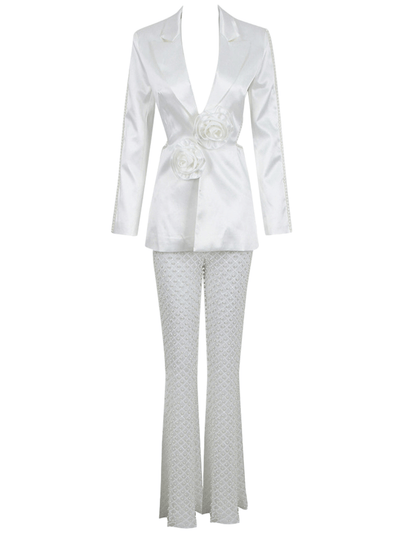 Sophisticated suit featuring a long-sleeved blazer adorned with 3D flowers, paired with trousers embellished with pearls for a stylish ensemble