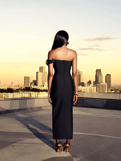 Back view of fitted black one shoulder gown