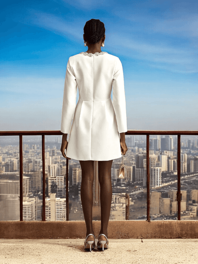 White Long Sleeve Crystal A-Line Dress with sparkling details and a flattering silhouette for weddings and formal events.