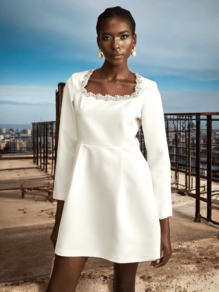 White Long Sleeve Crystal A-Line Dress with sparkling details and a flattering silhouette for weddings and formal events.
