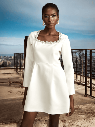 White Long Sleeve Crystal A-Line Dress with sparkling details and a flattering silhouette for weddings and formal events.