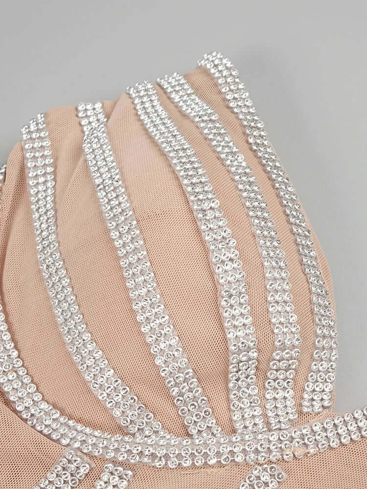 Nude strapless dress with rhinestone accents and fringe detailing