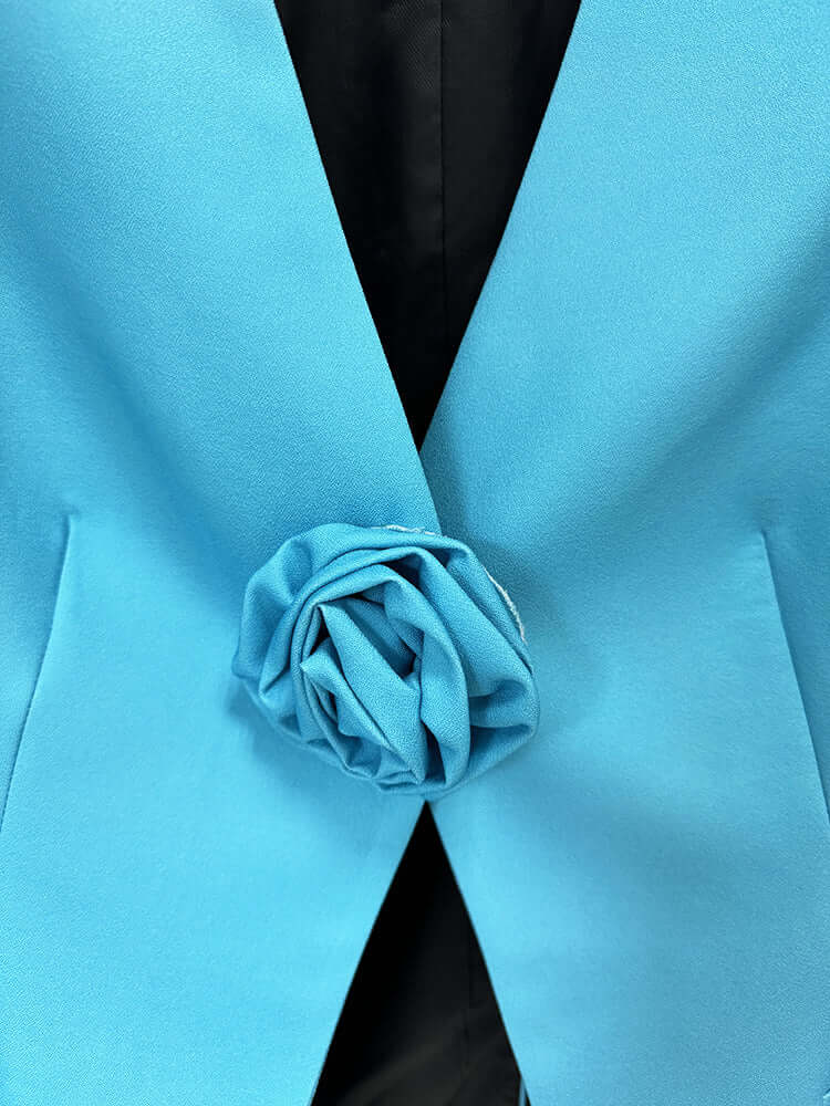 Close-up of blue Flower Blazer Set with floral design detail.