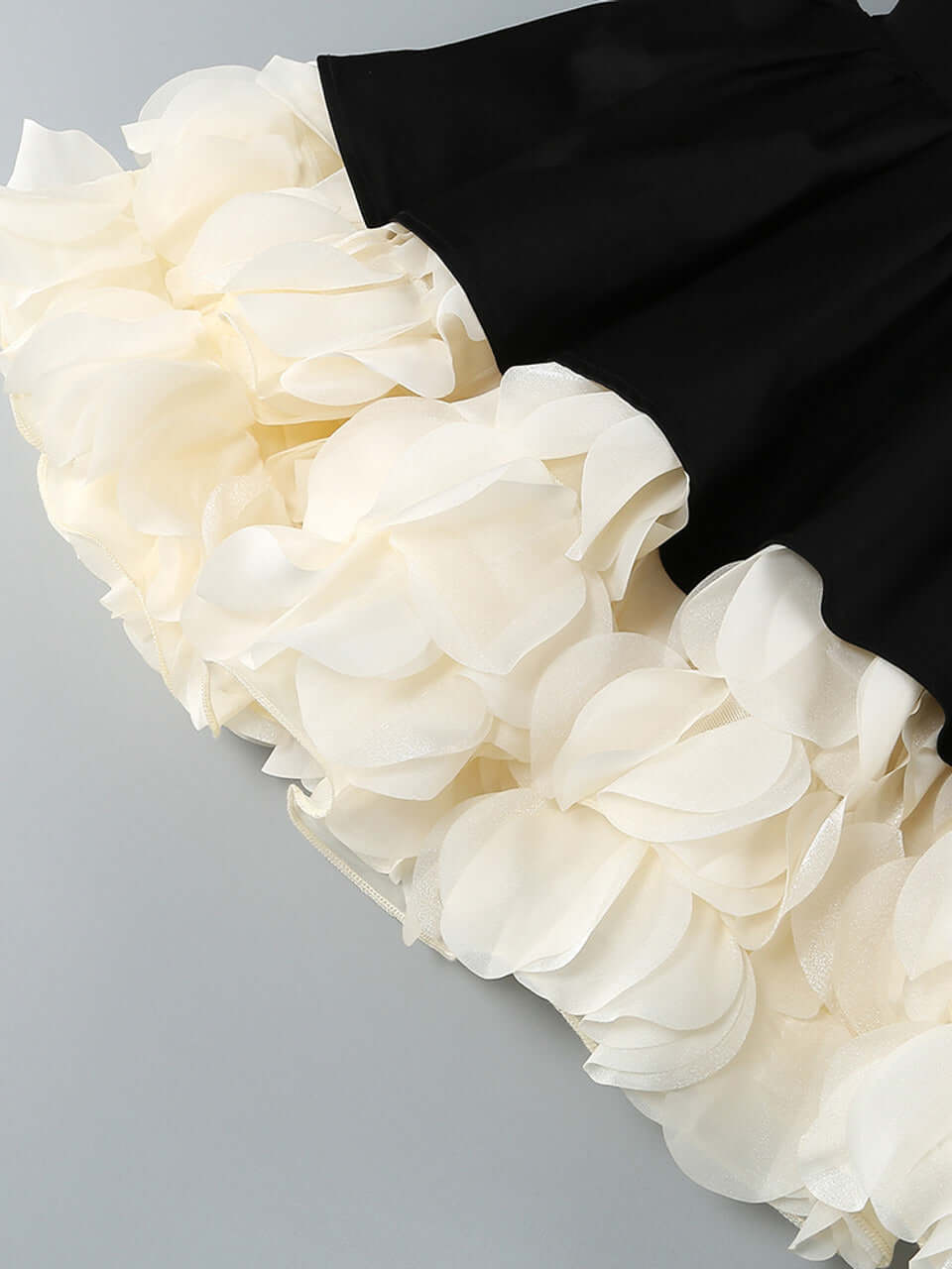 Close-up of floral petal detailing on Liz doll-inspired mini dress