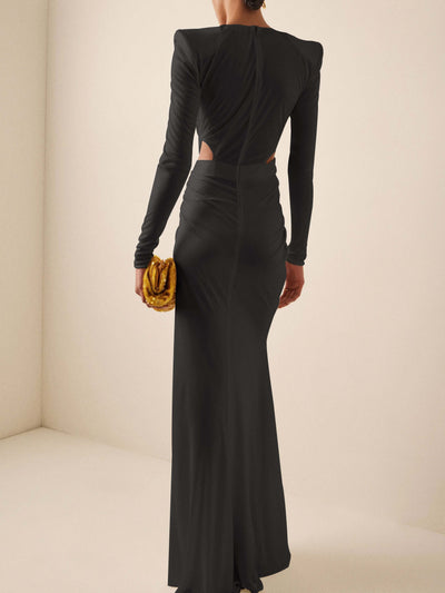 Black maxi dress with long sleeves and draped design.
