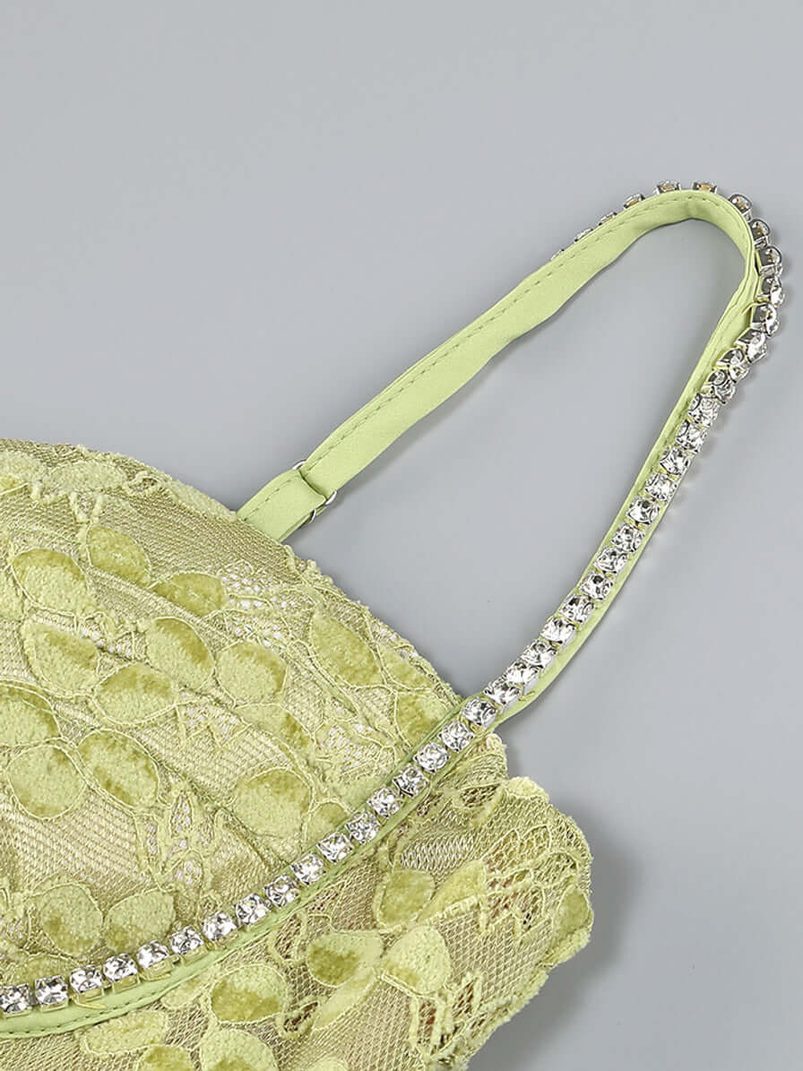 Close-up of Crystal Bustier Lace Midi Dress Green showing intricate lace and crystal details.