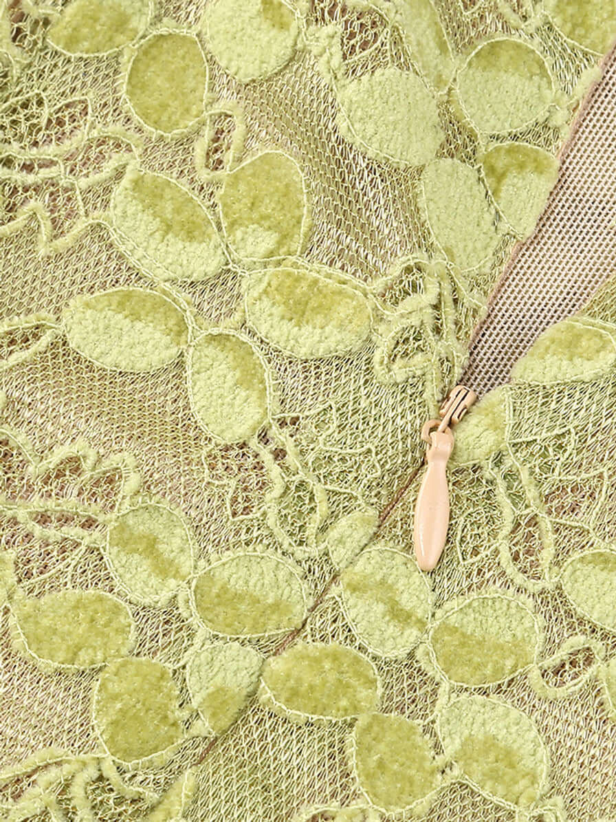 Close-up of green lace fabric and zipper on Crystal Bustier Lace Midi Dress.