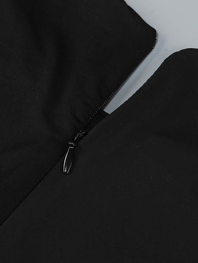 Black long sleeve mini dress with crystal embellishments and draped neckline for formal events