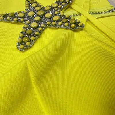 Luxury set featuring a beaded starfish diamond top and high-waisted split skirt