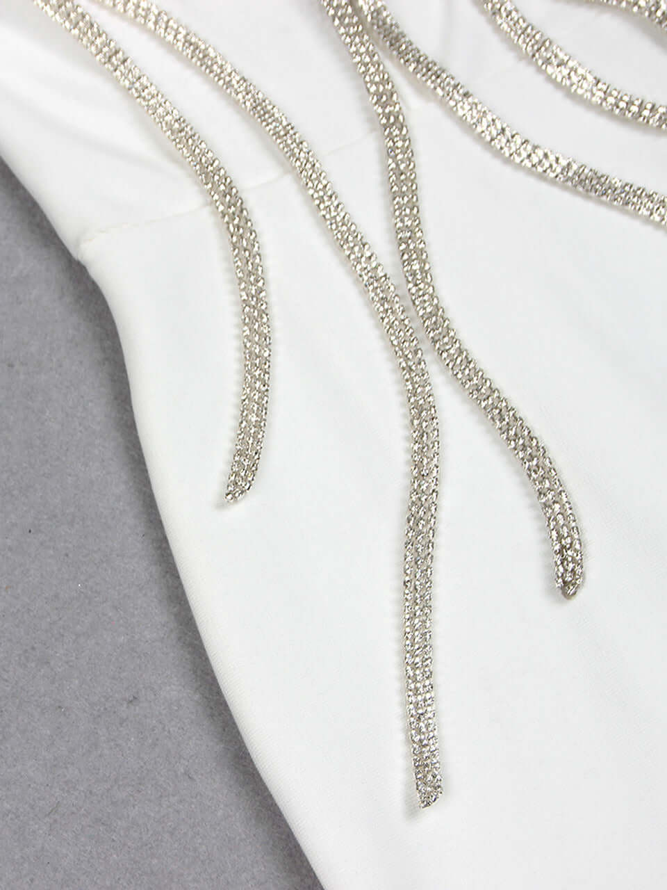 White Strapless Flower Detail Crystal Mermaid Maxi Dress with floral and crystal embellishments for weddings and formal events.
