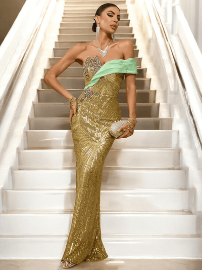 Confident woman wearing a sparkling green maxi dress at a glamorous red-carpet event