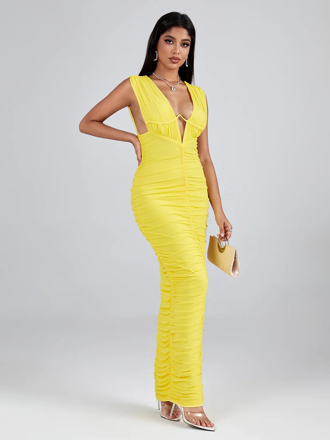 Sunny yellow maxi dress with a deep V-neck, sleeveless design, and flattering ruched detailing in mesh fabric