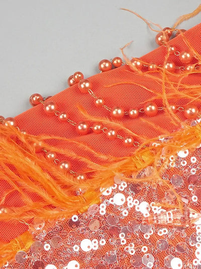 Flowing orange maxi dress from Noura Couture adorned with pearls