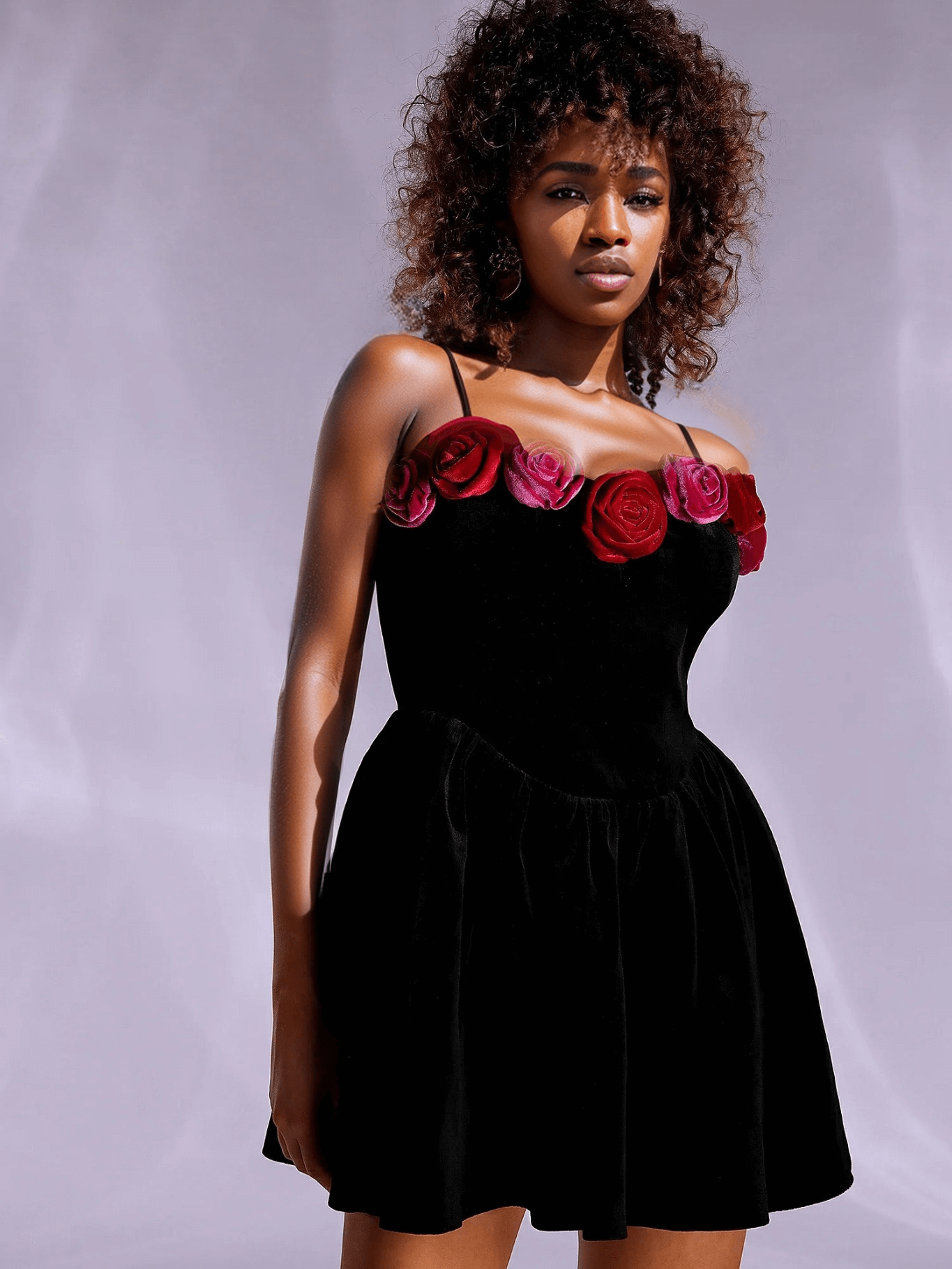 Black halter dress with cutout flower details adorned with sequins