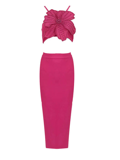 Chic pink bandage crop top and midi skirt set adorned with floral patterns and pearl embellishments