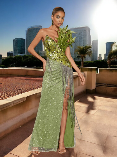 Emerald green sequin feather dress with thigh slit, worn at outdoor wedding
