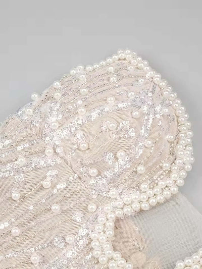 Ufana Pearl Detail Maxi Dress in Beige - elegant, pearl embellishments, flowing silhouette, sophisticated design