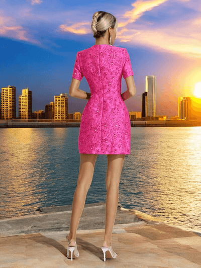 Back view showing stretch zip on pink floral sequin mini dress