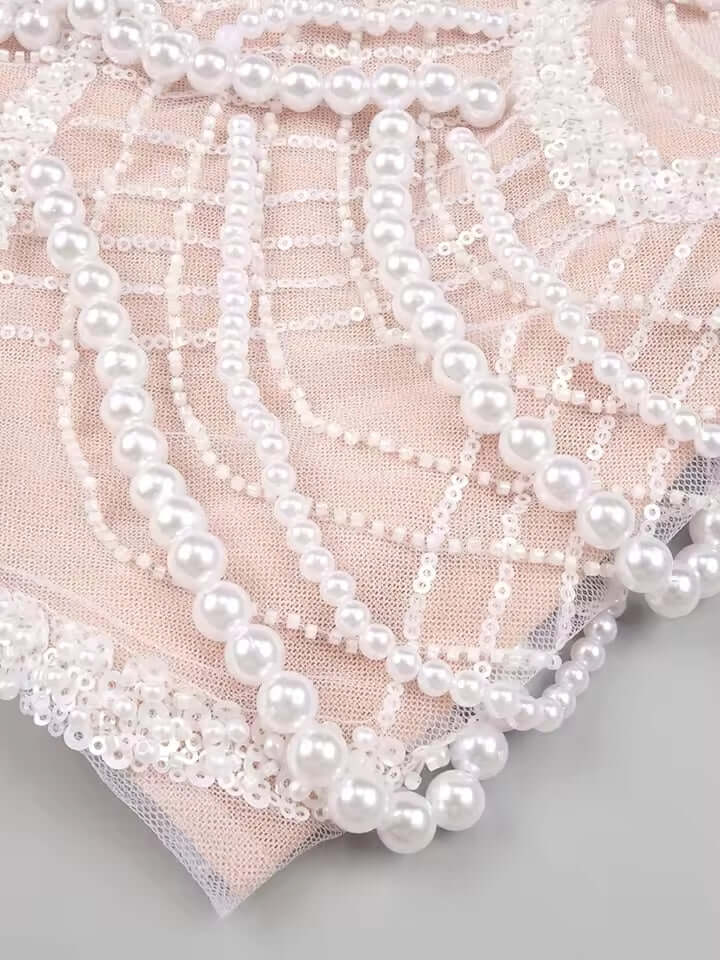 Miha Off The Shoulder Pearl Mini Dress with delicate pearl accents and off-the-shoulder design.