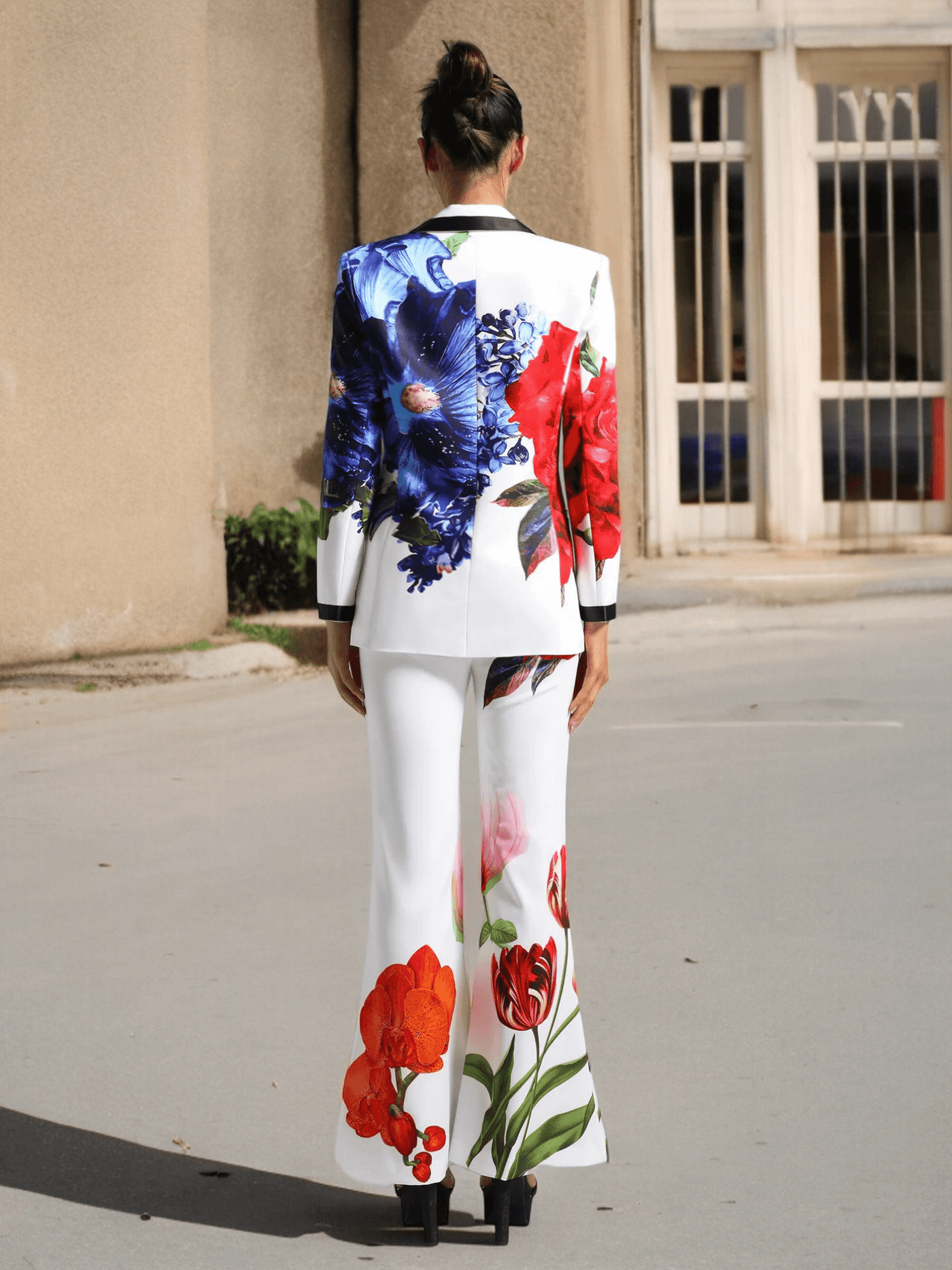 Back view of Floral Printed Blazer Set featuring vibrant blue and red flowers on white polyester and cotton fabric