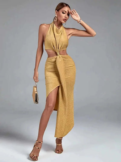 Stunning gold asymmetric dress with a halterneck and backless design for a glamorous look