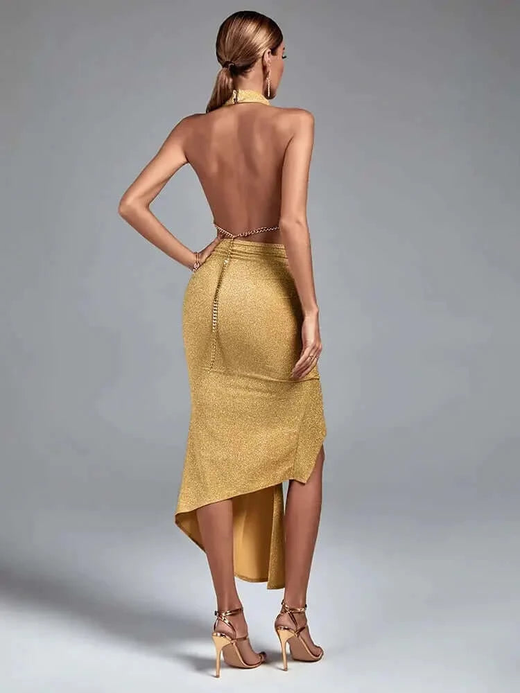 Stunning gold asymmetric dress with a halterneck and backless design for a glamorous look